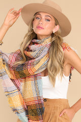 Front view of this scarf that features a plaid pattern throughout.