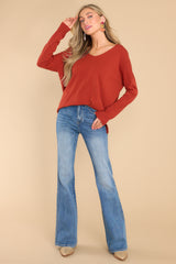 Full body view of this sweater that features seam down the center front, a v-neckline, and long sleeves.