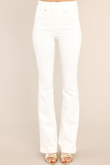 Front view of these jeans that feature flared legs, belt loops, and an elastic waistband.