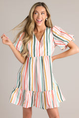 Full front view of this dress that showcases the multi-colored striped pattern in shades of pink, yellow, green, blue, and white.