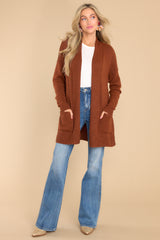 This copper colored cardigan features front pockets, an oversized cozy fit, and soft knit fabric.