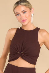 Front view of this top that features a gold ring detail at the center.