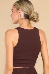 Back view of this top that features a round neckline, a cropped length, and a ring detail at the center.