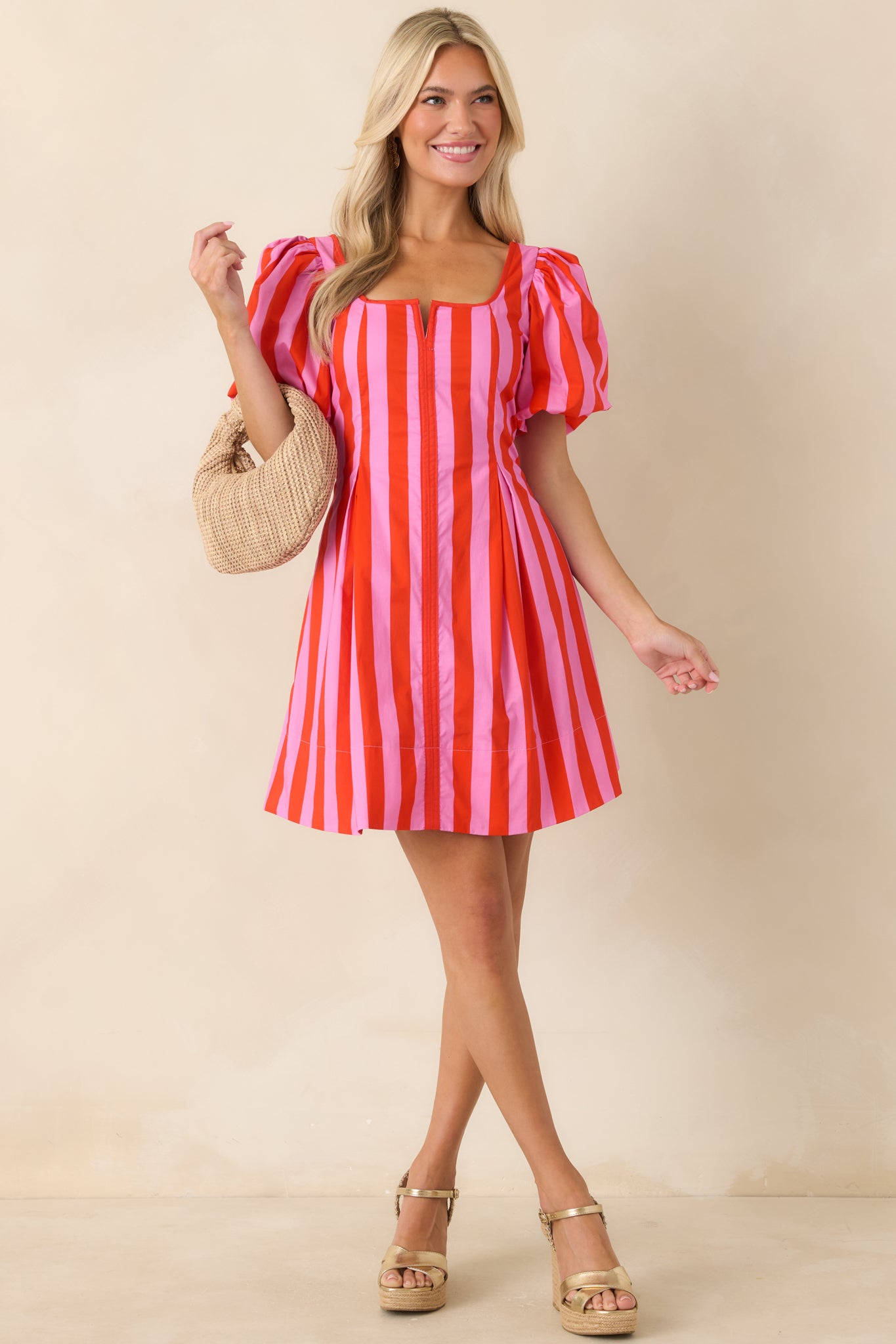 Cotton mini dress showcasing a flattering square neckline and voluminous sleeve design.