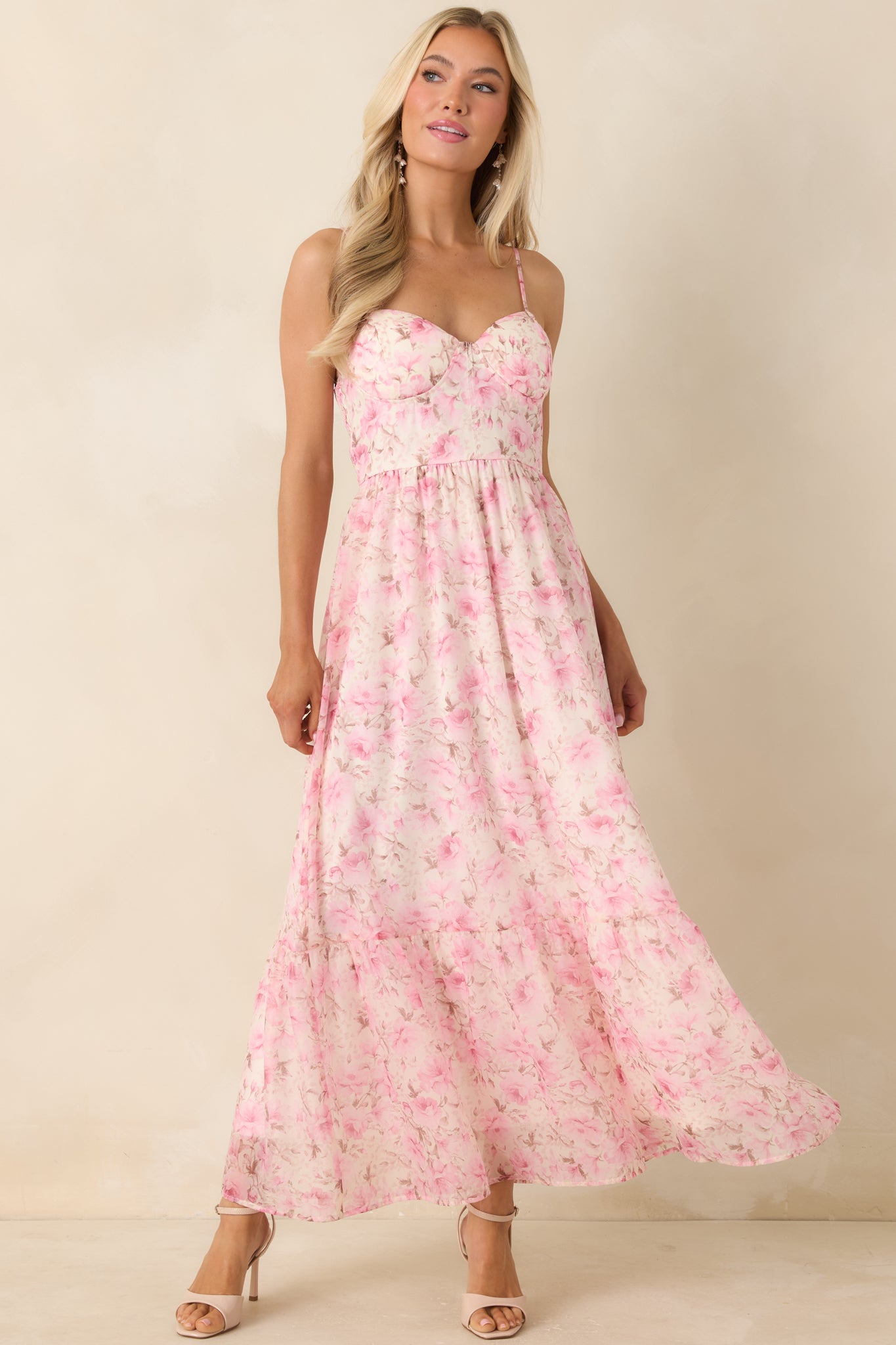 Pink multi floral midi dress with bustier-style bodice and adjustable spaghetti straps.