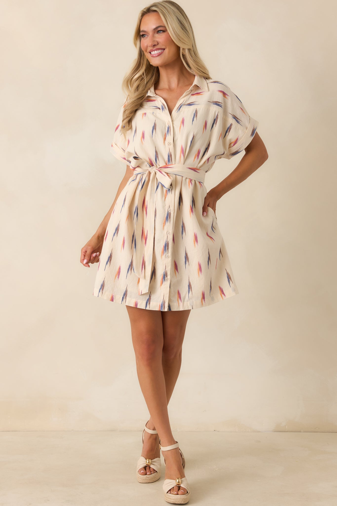 Cream multi print cotton shirt dress featuring a collared neckline, button-front closure, and colorful brushstroke print throughout.
