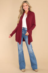 Full body view of this cardigan that features a large slouchy folded collar, ribbed fitted cuffs, and ribbed hemline details.