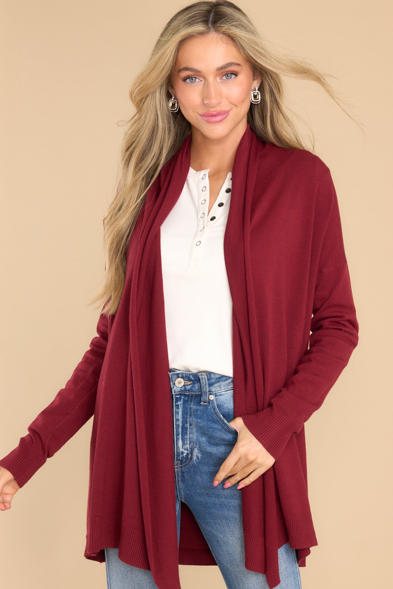 Close up of this cardigan that features a large slouchy folded collar and ribbed fitted cuffs.