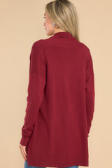 Back view of this cardigan that features a large slouchy folded collar, ribbed fitted cuffs, and ribbed hemline details.