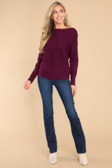 Full body view of this sweater that features a round neckline and a soft stretchy material.