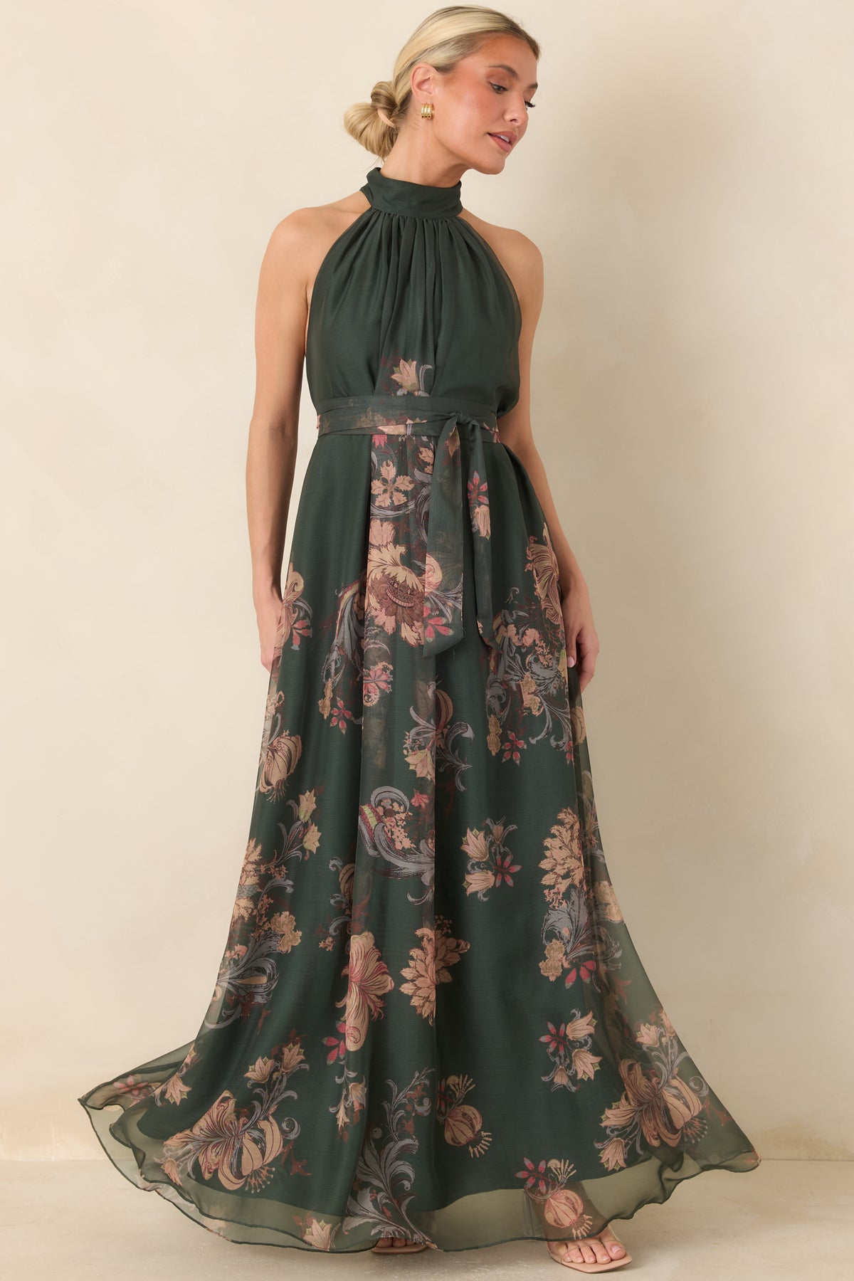 Winding vintage-inspired botanicals cover the sheer outer layer of this forest green maxi dress with a full flowing silhouette.
