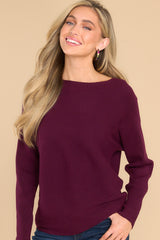 Front view of this sweater that features a round neckline and a soft stretchy material.