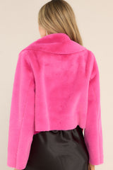 Back view of this jacket that features a folded collar, a super soft faux fur material, and a cropped hemline.