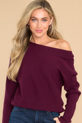Front view of this sweater that showcases a soft stretchy material that can be worn on the shoulder.