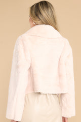 Back view of this jacket that features a folded collar, a super soft faux fur material, and a cropped hemline.