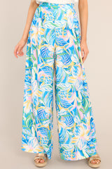 These blue multi pants feature a high-rise slip-on design, a waistband with elastic stretch in the back, and a flowy, wide-leg pant style.