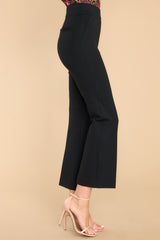 Side view of these pants that feature a pull-on design that hits the hipline and non functional pockets.