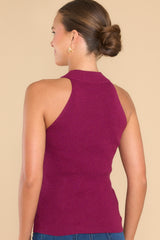 Back view of this tank top that features a halter neckline, ribbed stretchy fabric, and a super soft feel.