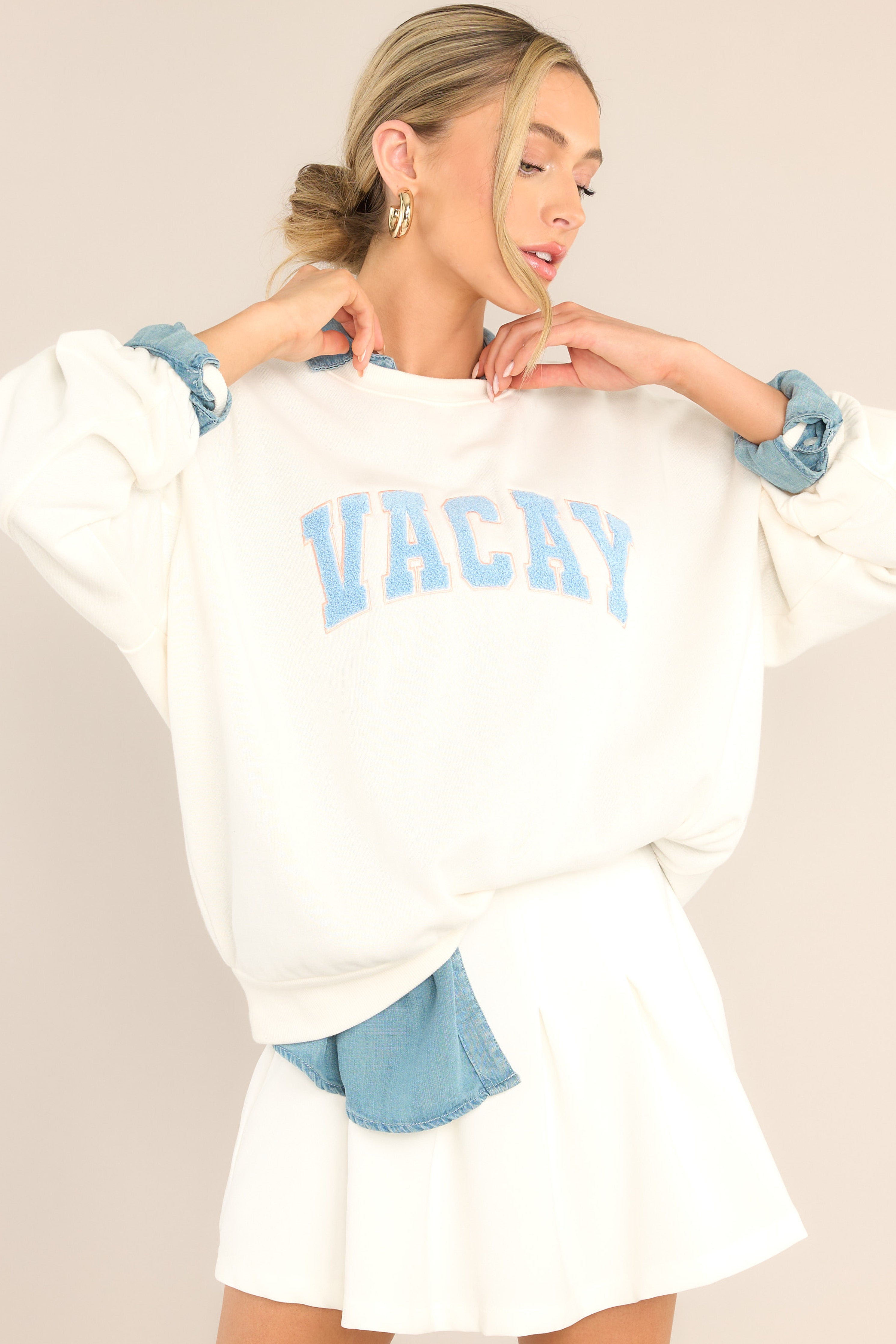 Front view of this sweatshirt that features a ribbed crew neckline, dropped shoulders, terry cloth wording, a ribbed hemline, and ribbed cuffed long sleeves.