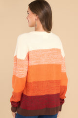 Back view of this sweater that features a round ribbed neckline, long sleeves, and a fun ombre striped design.