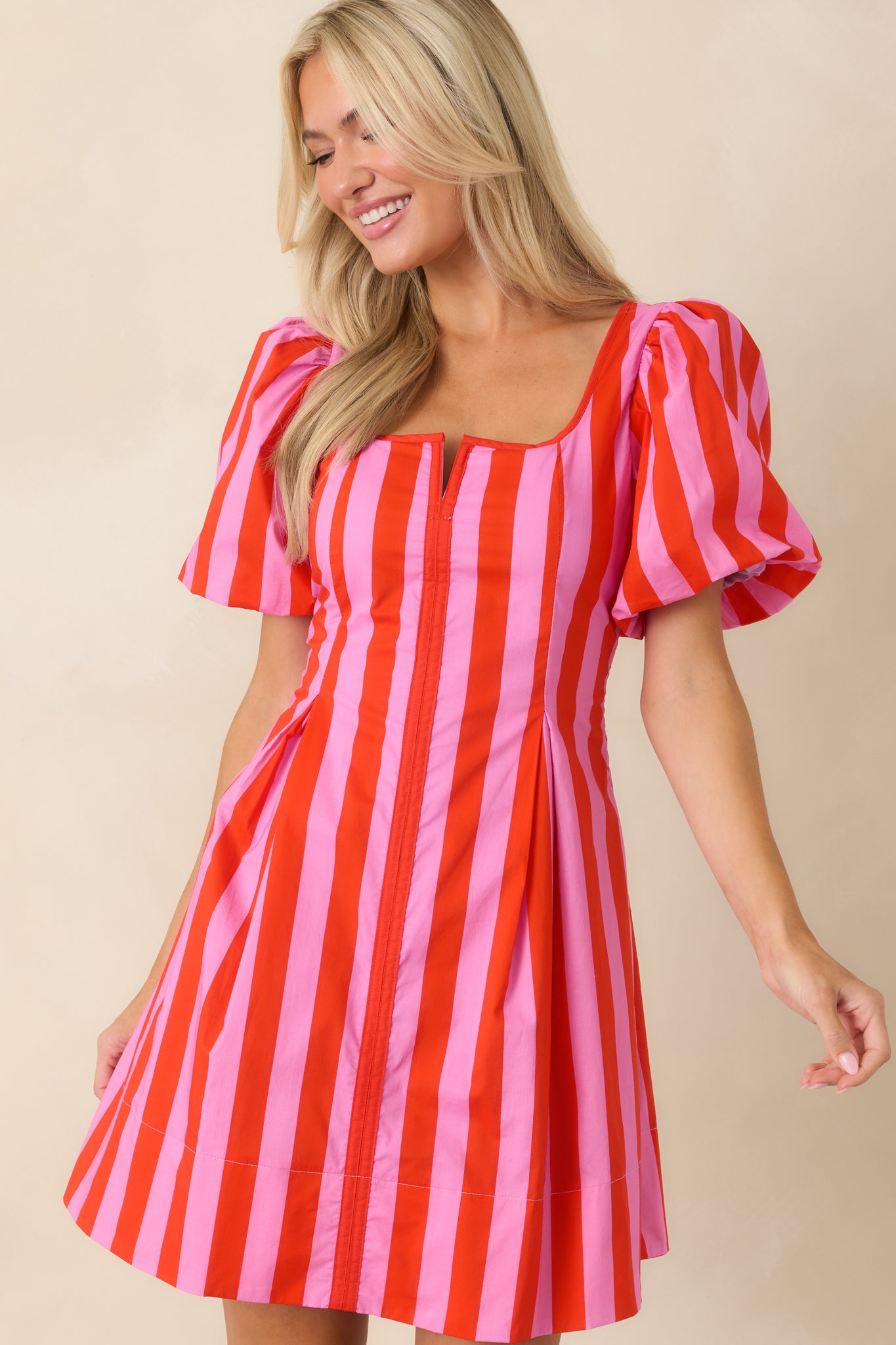 Cotton dress showcasing fitted bodice and smooth seam detailing through the waist.