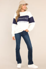 Full body view of this sweatshirt that features embroidered text, a crew neckline, ribbed hems, and a cozy oversized fit.