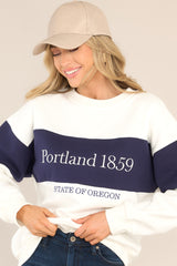 Front view of this sweatshirt that features embroidered text, a crew neckline, ribbed hems, and a cozy oversized fit.