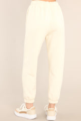 Back view of these joggers that feature a self-tie drawstring waist, pockets, and cuffed elastic ankles.