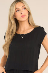 Front view of this top that features a cap sleeve design, a crew neckline, slightly cropped length, and breezy lightweight fabric.