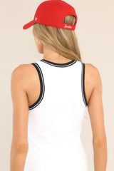 Back view of this tank top that features a scoop neckline, removable pads in the bust, an elastic band below the bust for support, and a cropped length.