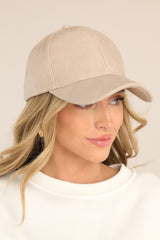 Front view of this hat that features a faux leather material, and an adjustable velcro strap in the back.