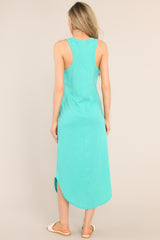 Back view of this dress that features a scoop neckline, a super soft material, a vibrant color, and a scooped hemline.