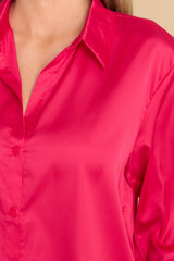 Close up view of this top that features a collared neckline, v-neckline and buttons down the front.