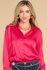 Front view of this top that features red buttons down the front.