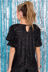 Back view of this top that features a round neckline, a keyhole opening on the back, puff sleeves with elastic cuffs, and sequins throughout.
