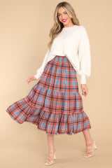Full body view of  this dress skirt that features a strapless design, a smocked bust, and a flowy tiered skirt.
