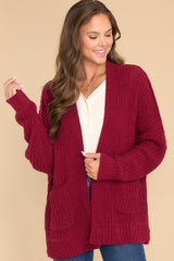 Front view of this cardigan that features a soft chunky knit design and functional pockets.