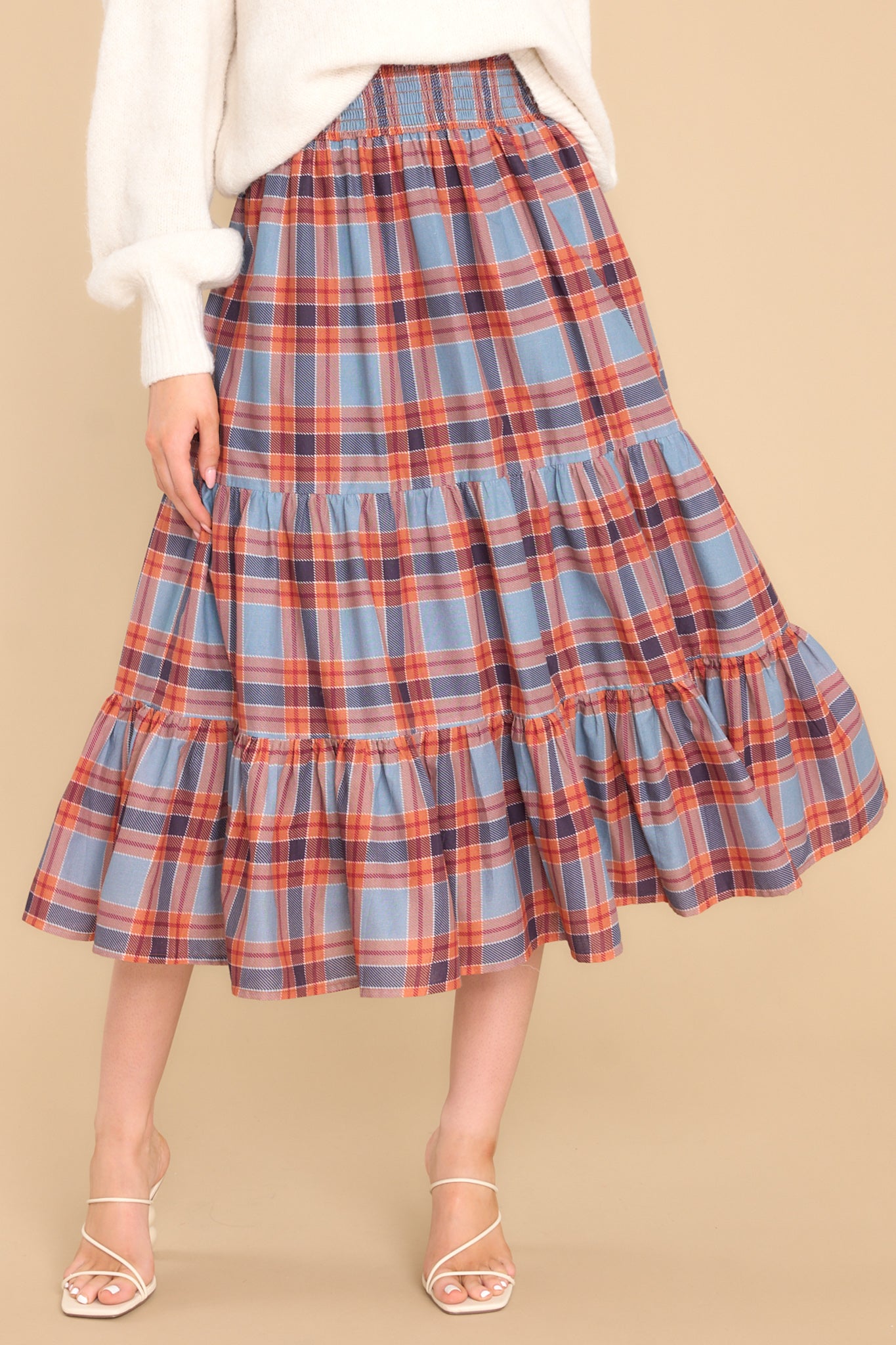 This multi-colored dress skirt features a strapless design, a smocked bust, and a flowy tiered skirt.