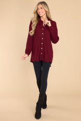 Full body view of this top that features button-down closures on the front and a collared neckline.