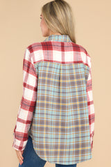 Back view of this top that features button-down closures on the front, a collared neckline, cuffed sleeves, and a chest pocket.