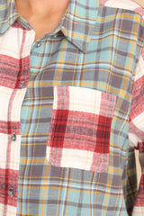 Close up view of this top that features button-down closures on the front, a collared neckline, and a chest pocket.