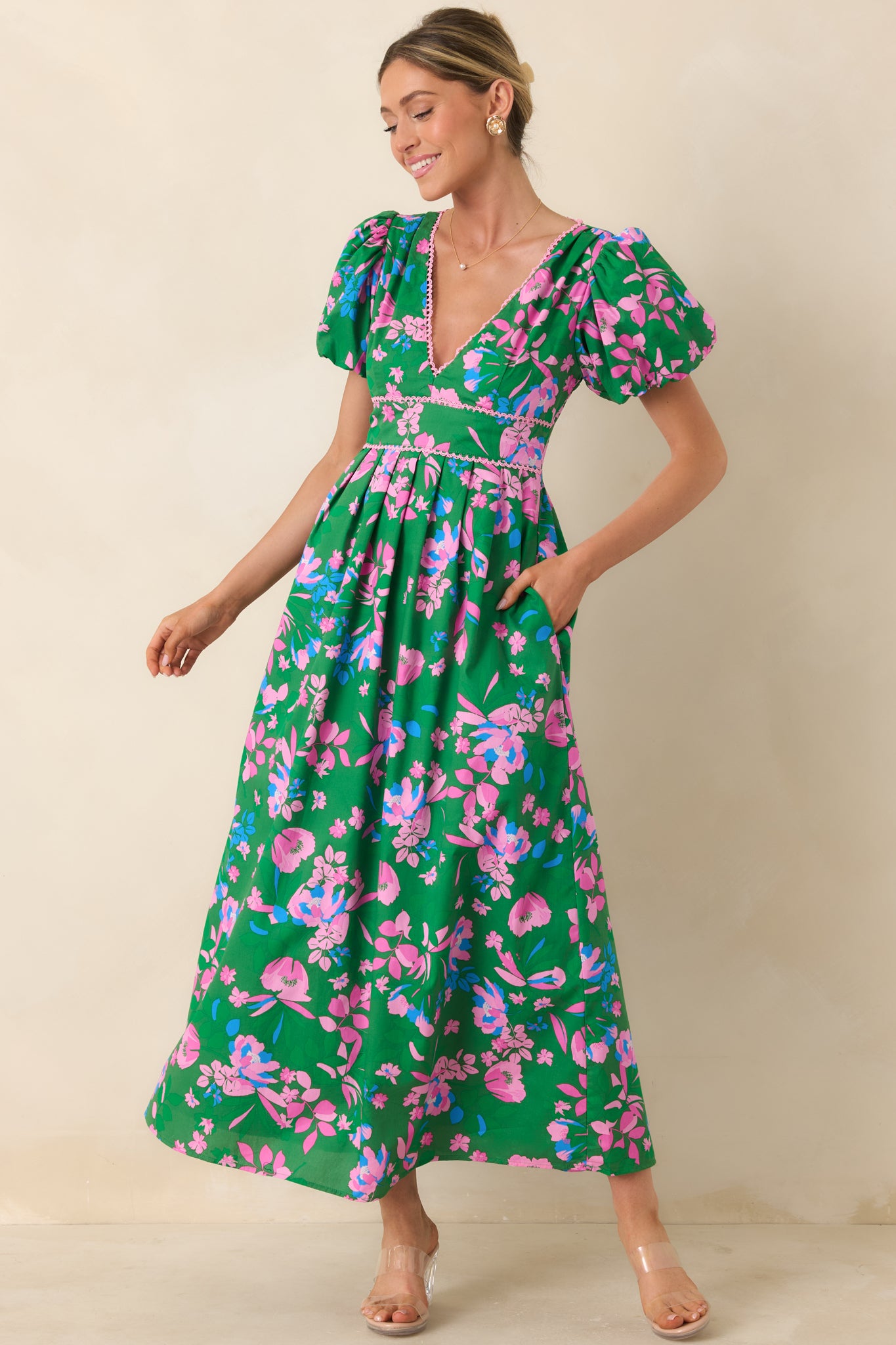 Maxi dress featuring a fluid skirt silhouette and flexible smocked waistline.