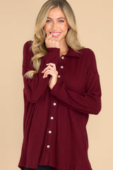 Front view of this top that features button-down closures on the front, a collared neckline, cuffed sleeves, and a chest pocket.