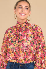 Front view of  this top that features a high neck.