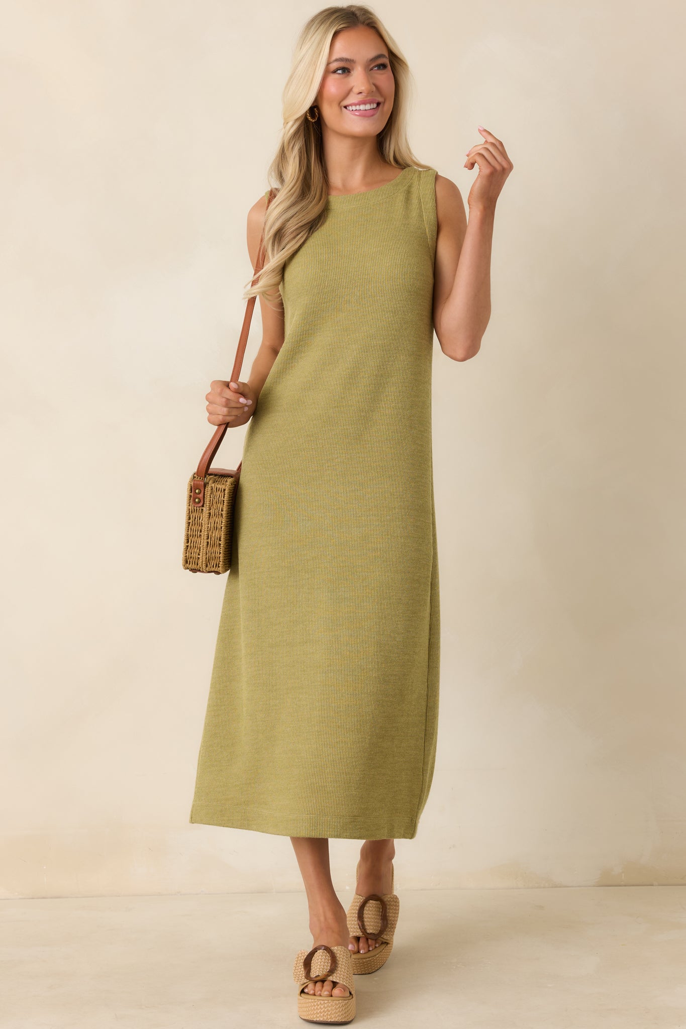 Rib knit olive midi dress featuring a streamlined shape and comfortable sleeveless design.