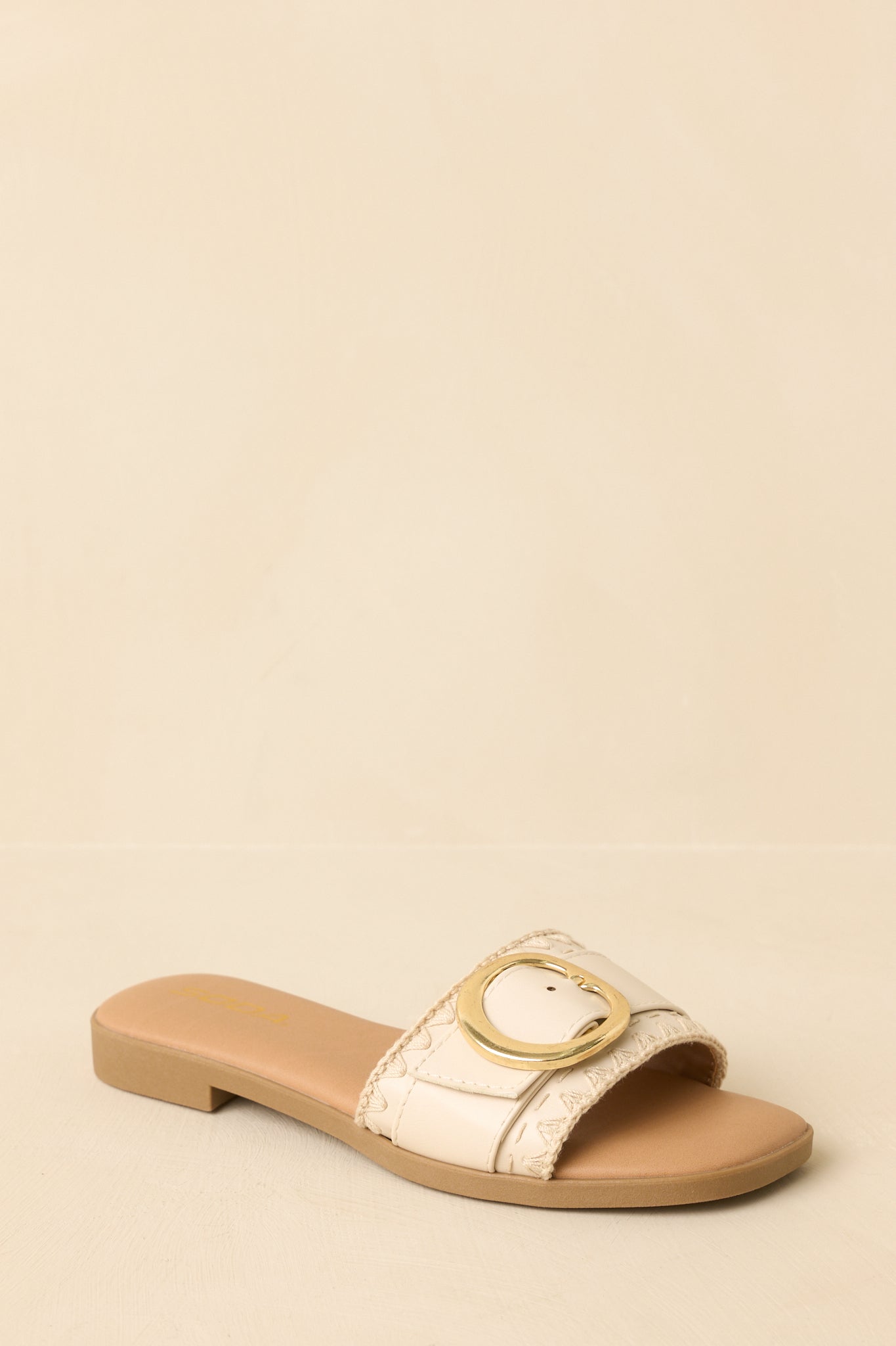 Sandals angled to highlight the gold-tone buckle accent and open-toe silhouette.