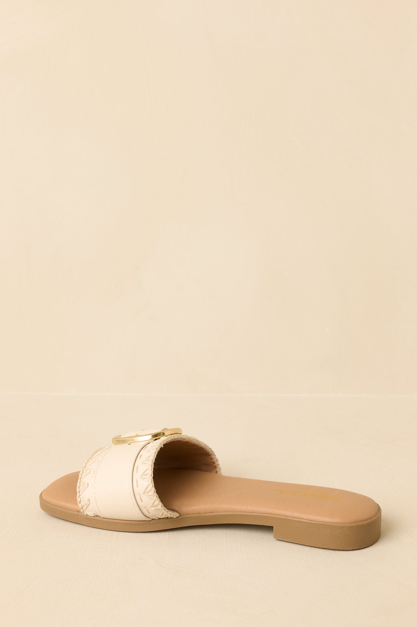 Sandals displayed to show the slip-on construction and minimalist flat design.