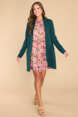 Full body view of this cardigan that features an open front design, two functional pockets, and long sleeves.