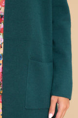 Close up view of this cardigan that features two functional pockets.