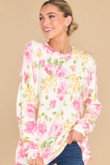 Front view of this sweater that features a crew neckline, an all over floral print, and cuffed sleeves.